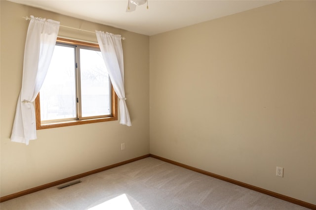 unfurnished room featuring light carpet, baseboards, and visible vents