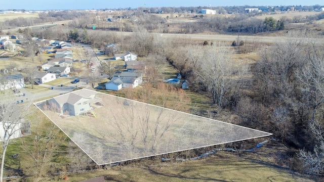 birds eye view of property with a residential view