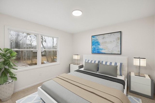 carpeted bedroom with baseboards