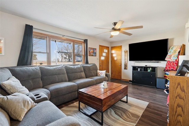 living area featuring a ceiling fan and wood finished floors