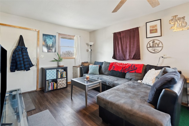 living area with dark wood-style flooring and a ceiling fan