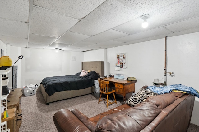 carpeted bedroom featuring a paneled ceiling