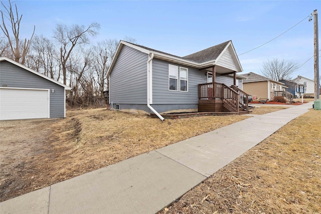 view of side of property featuring an outbuilding