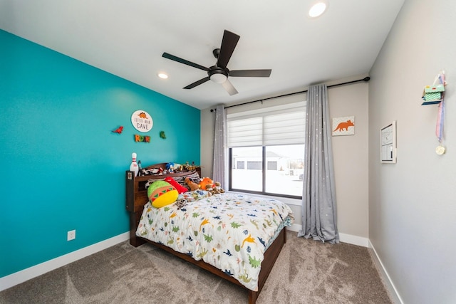 bedroom featuring carpet floors, baseboards, and a ceiling fan