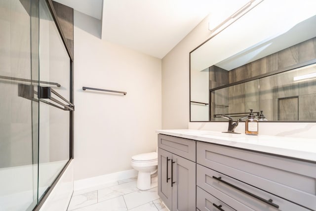 full bathroom with toilet, vanity, baseboards, marble finish floor, and combined bath / shower with glass door