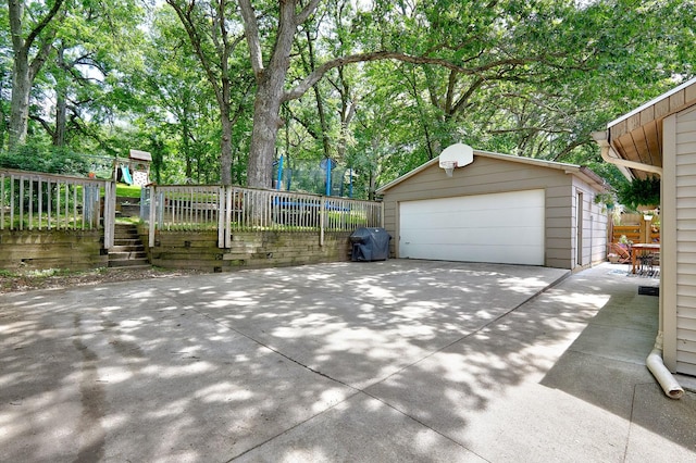 exterior space with a trampoline and fence