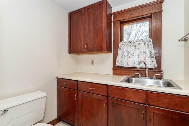 kitchen with light countertops and a sink