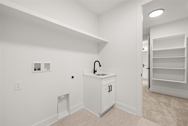 laundry area featuring a sink, hookup for an electric dryer, light colored carpet, hookup for a washing machine, and laundry area