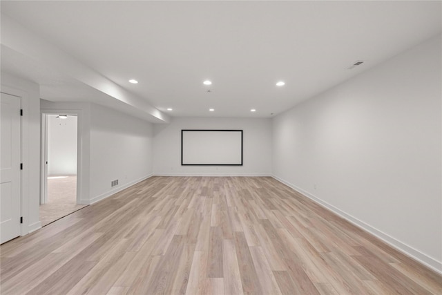 home theater room with recessed lighting, visible vents, baseboards, and light wood-style floors