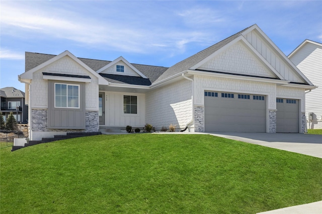 craftsman-style home featuring board and batten siding, a front lawn, a garage, stone siding, and driveway