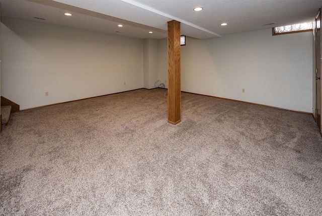 basement featuring baseboards, stairway, carpet flooring, and recessed lighting