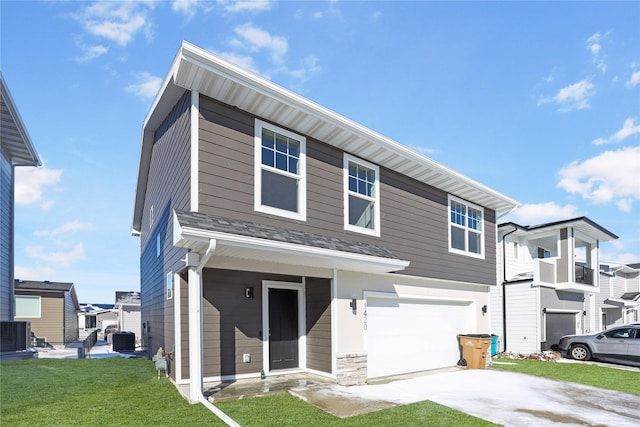 view of front of property with central AC, an attached garage, driveway, and a front yard