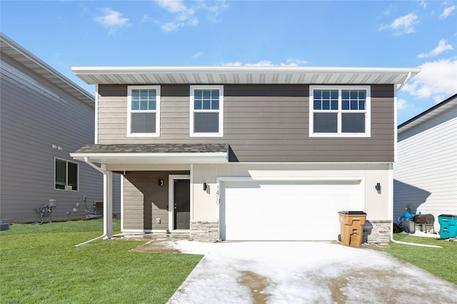 view of front of house featuring an attached garage, stone siding, a front lawn, and concrete driveway