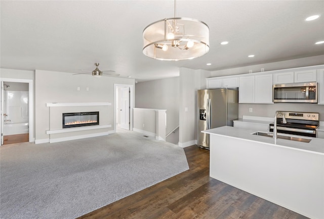 kitchen with recessed lighting, white cabinetry, light countertops, appliances with stainless steel finishes, and pendant lighting