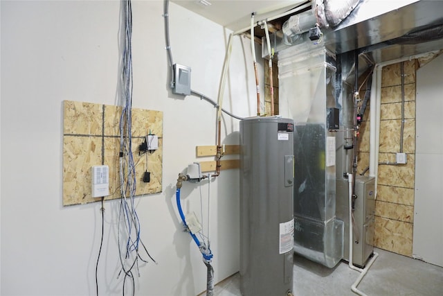 utility room featuring electric water heater and heating unit