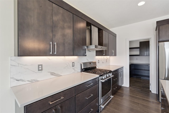 10598 NW 72nd Ln, Johnston, IA 50131 - kitchen with gas range, wall chimney exhaust hood, dark wood-style flooring, and dark brown cabinetry