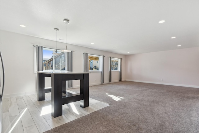 10598 NW 72nd Ln, Johnston, IA 50131 - unfurnished dining area featuring recessed lighting and baseboards