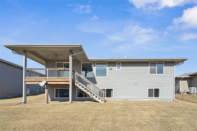 back of house featuring ceiling fan, central AC unit, stairway, a lawn, and a wooden deck