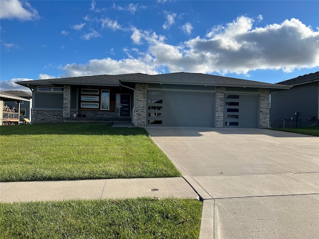10598 NW 72nd Ln, Johnston, IA 50131 - prairie-style home featuring stone siding, a garage, concrete driveway, and a front yard