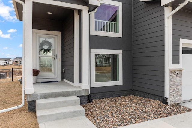 property entrance featuring fence