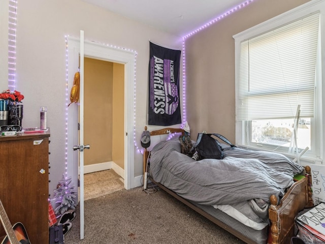 carpeted bedroom with baseboards