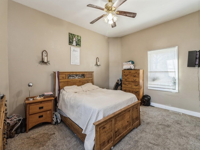 bedroom featuring carpet flooring, a ceiling fan, and baseboards