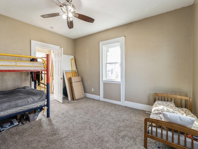 bedroom featuring carpet flooring, baseboards, and ceiling fan