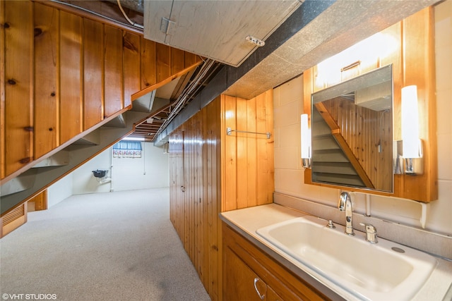 interior space featuring wood walls and vanity