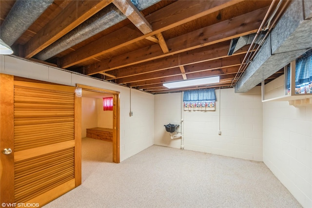 finished basement featuring carpet flooring