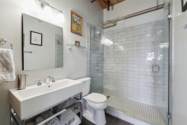 bathroom featuring a stall shower, vanity, and toilet