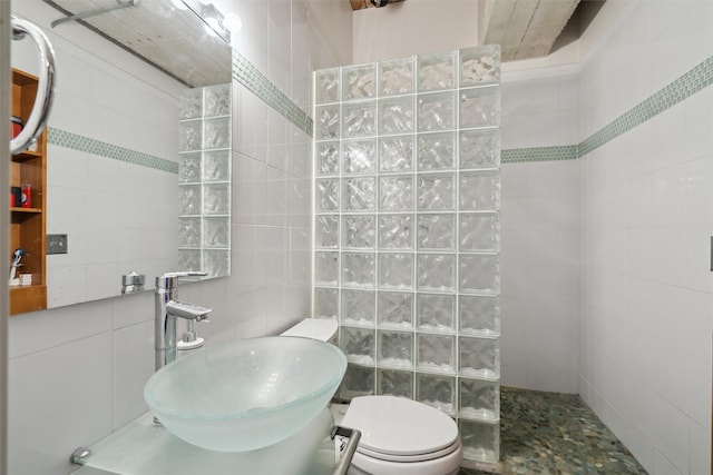 100 Market St Unit 409, 408, 407, Des Moines, IA 50309 - bathroom with a sink, a walk in shower, and tile walls
