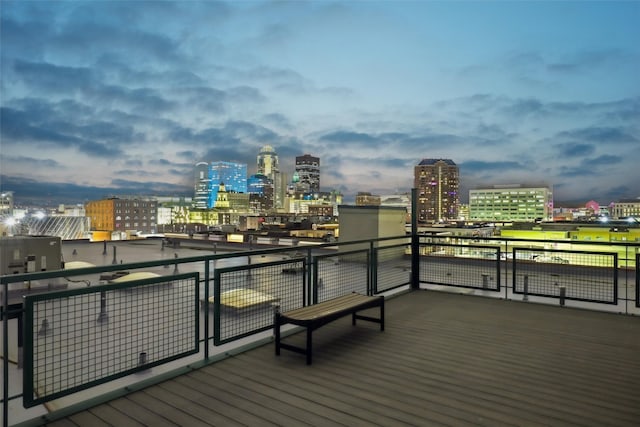 wooden deck with a city view