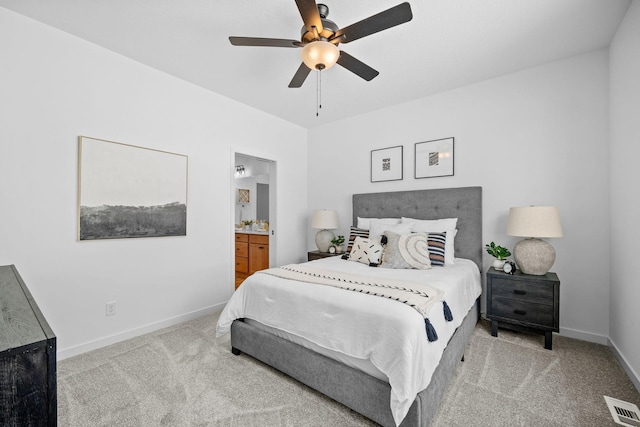 bedroom with visible vents, carpet flooring, connected bathroom, ceiling fan, and baseboards