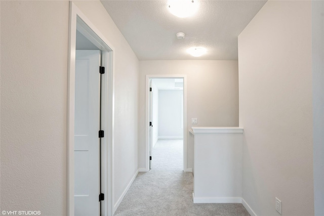 2908 Yordi Dr, Norwalk, IA 50211 - hall featuring carpet flooring, baseboards, and a textured ceiling