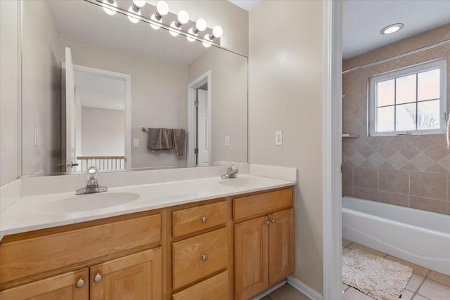 full bath featuring double vanity, a sink, shower / bathtub combination, and tile patterned floors