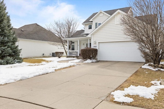 traditional home featuring covered porch and concrete driveway