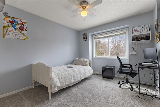 bedroom with a textured ceiling, ceiling fan, carpet flooring, and baseboards