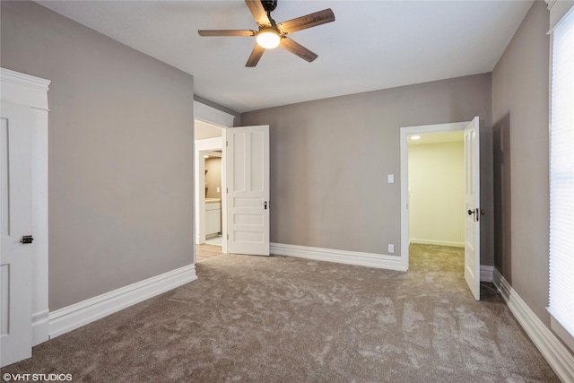 unfurnished bedroom with carpet floors, baseboards, and a ceiling fan