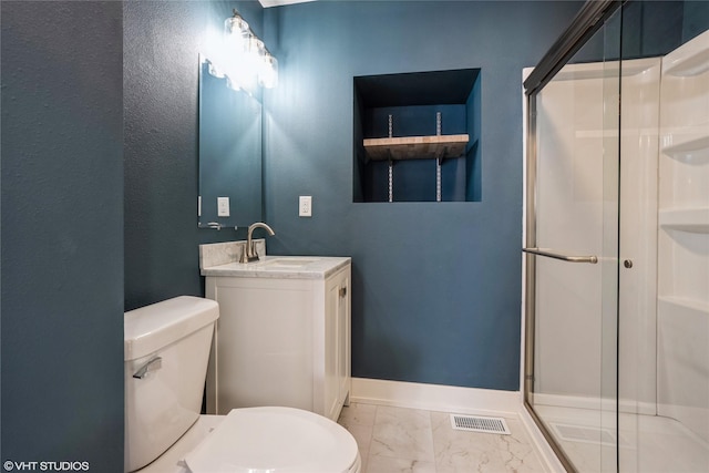 bathroom featuring baseboards, toilet, marble finish floor, vanity, and a shower stall