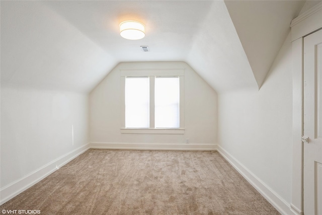 bonus room featuring vaulted ceiling, carpet, visible vents, and baseboards