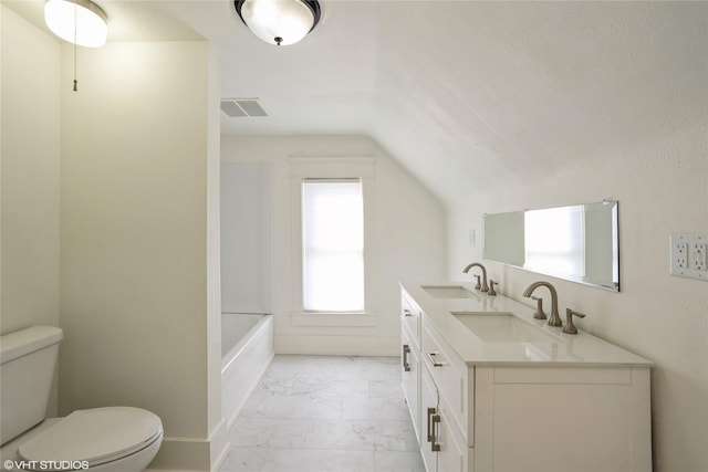 201 E 4th St S, Newton, IA 50208 - full bath with marble look tile flooring, vaulted ceiling, and double vanity