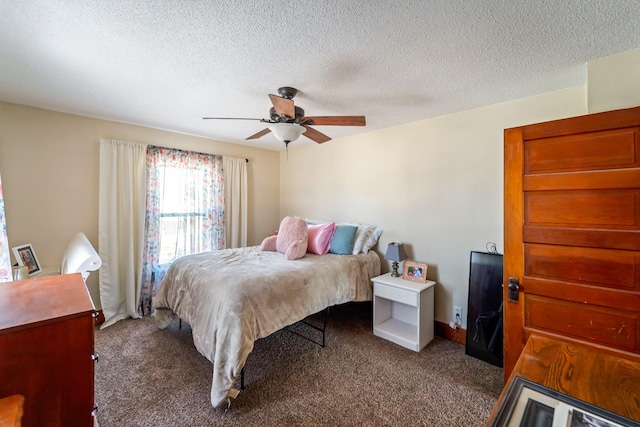 carpeted bedroom featuring ceiling fan and a textured ceiling