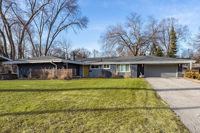 ranch-style home with aphalt driveway, a chimney, and a front lawn