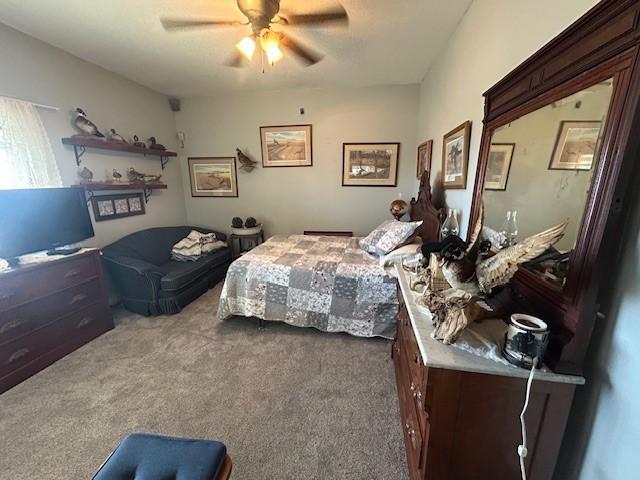 carpeted bedroom featuring a ceiling fan