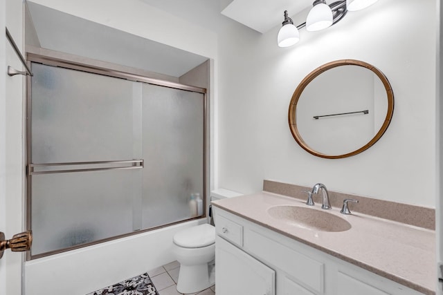 full bathroom with toilet, tile patterned flooring, enclosed tub / shower combo, and vanity