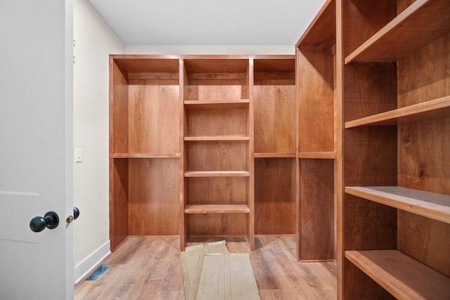 walk in closet featuring visible vents and light wood-style flooring