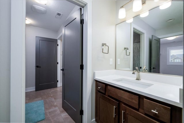 bathroom with visible vents and vanity