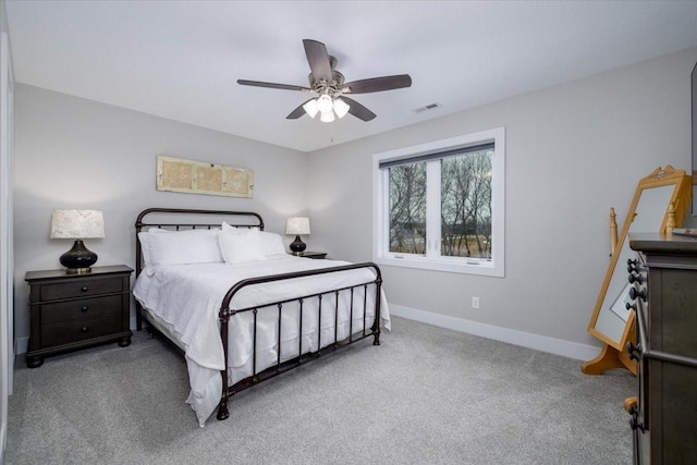 bedroom with visible vents, baseboards, carpet, and ceiling fan