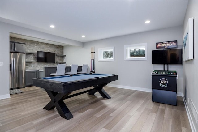 recreation room featuring billiards, baseboards, and light wood-type flooring