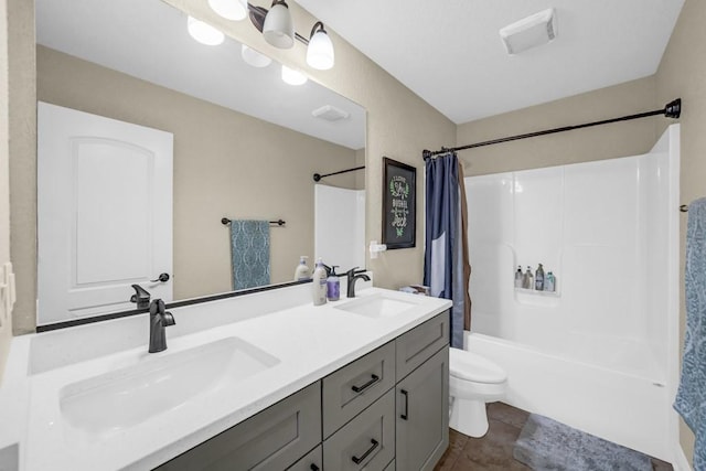 bathroom with toilet, shower / bath combo with shower curtain, a sink, and visible vents